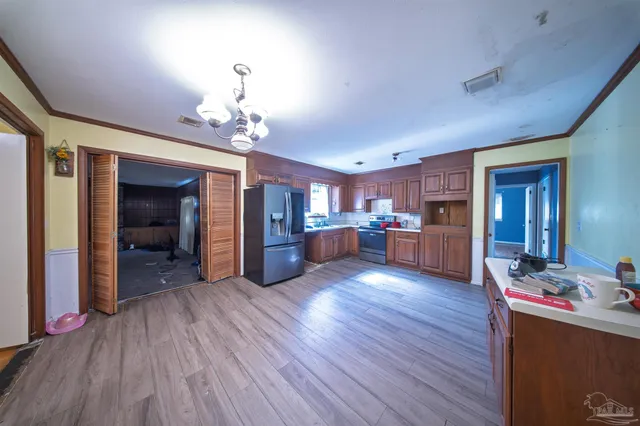 a view of a kitchen and dining room