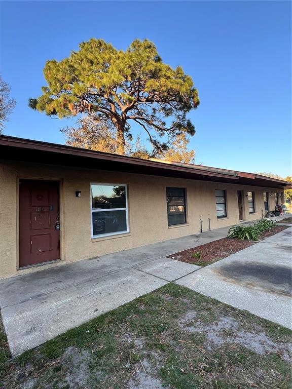 5807 Pine Street New Port Richey, FL 34652 - Photo 1 of 1 a front view of a house with a yard