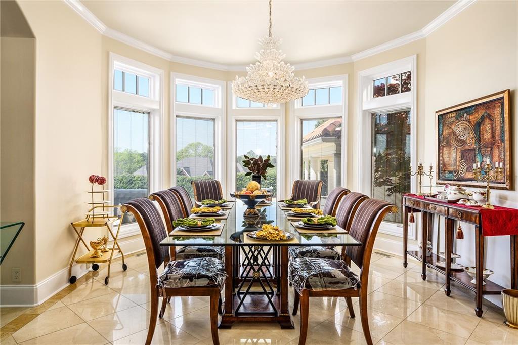 171 McClain Circle Macon, GA 31216 - Photo 15 of 56 a view of a dining room with furniture large windows and wooden floor