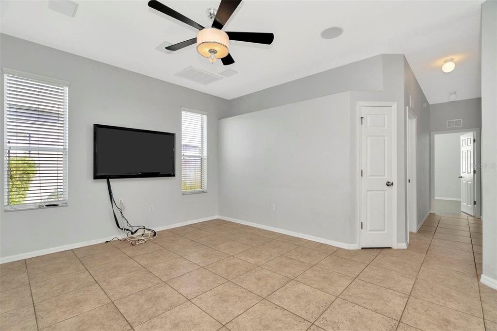 8918 Linebrook Drive Trinity, FL 34655 - Photo 13 of 50 a living room with a flat screen tv and a window
