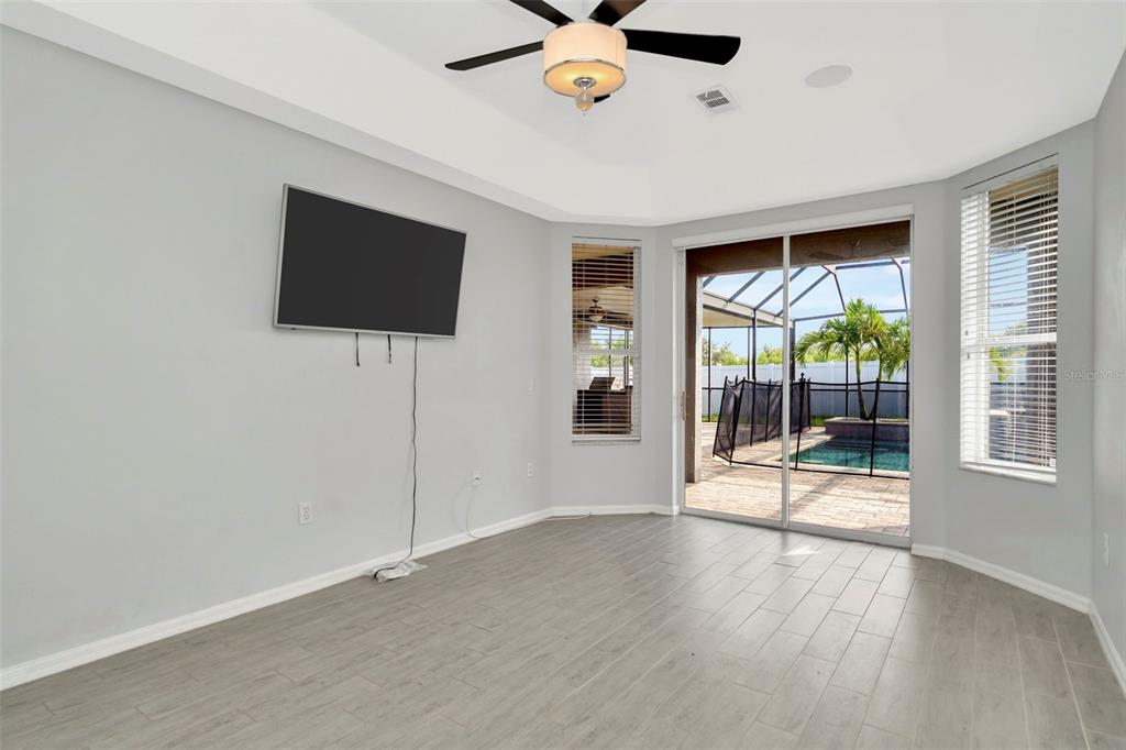 8918 Linebrook Drive Trinity, FL 34655 - Photo 15 of 50 wooden floor in an empty room with a window