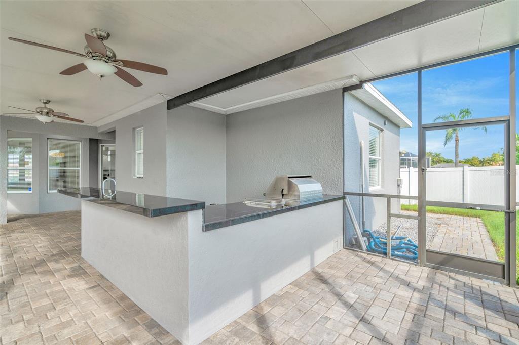 8918 Linebrook Drive Trinity, FL 34655 - Photo 24 of 50 a kitchen with stainless steel appliances granite countertop a sink and a refrigerator