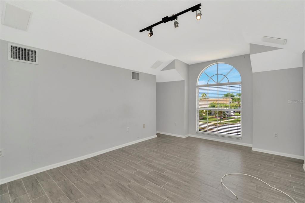 8918 Linebrook Drive Trinity, FL 34655 - Photo 28 of 50 wooden floor in an empty room with a window