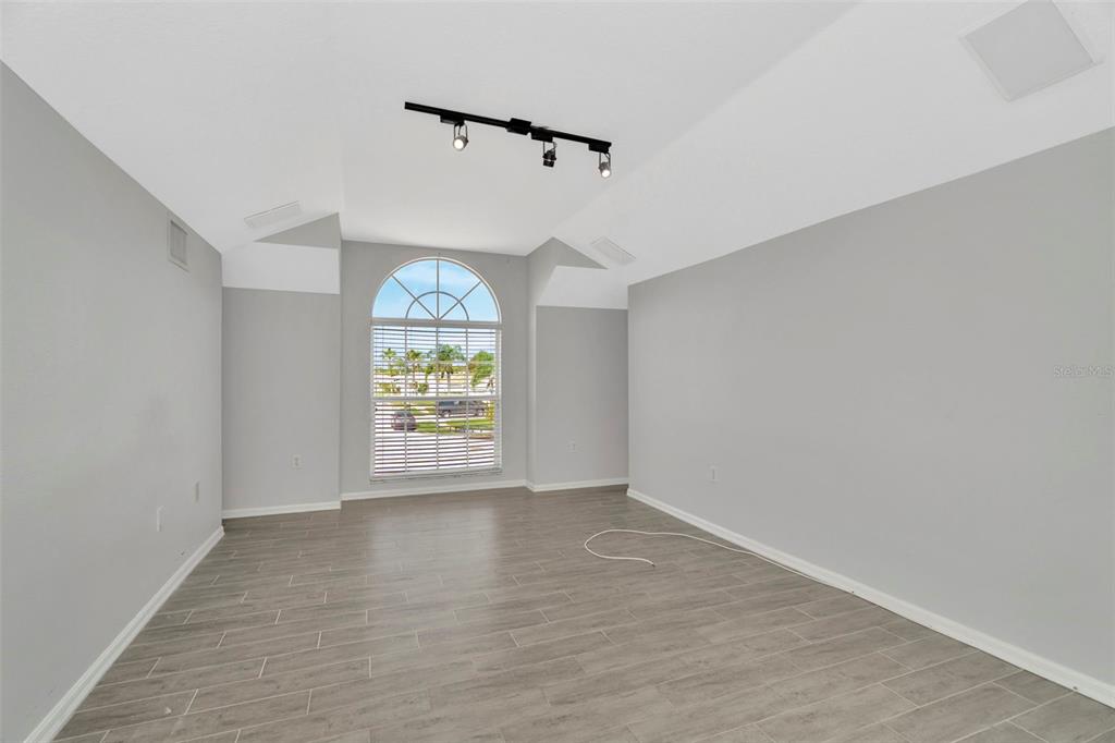 8918 Linebrook Drive Trinity, FL 34655 - Photo 29 of 50 wooden floor in an empty room with a window
