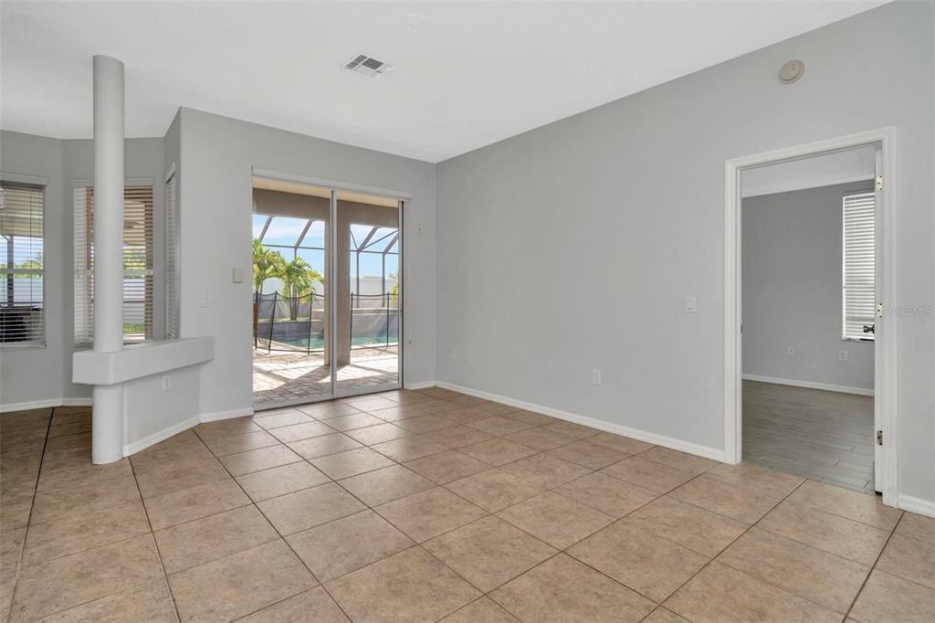 8918 Linebrook Drive Trinity, FL 34655 - Photo 32 of 50 a view of an empty room with window and chandelier