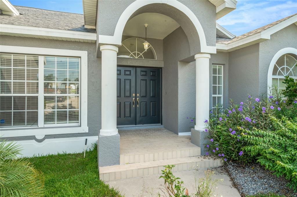 8918 Linebrook Drive Trinity, FL 34655 - Photo 46 of 50 a front view of a house with a yard