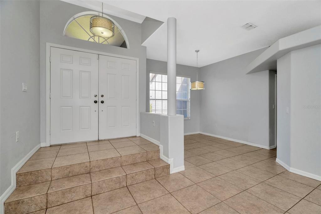8918 Linebrook Drive Trinity, FL 34655 - Photo 6 of 50 a view of an entryway with wooden floor