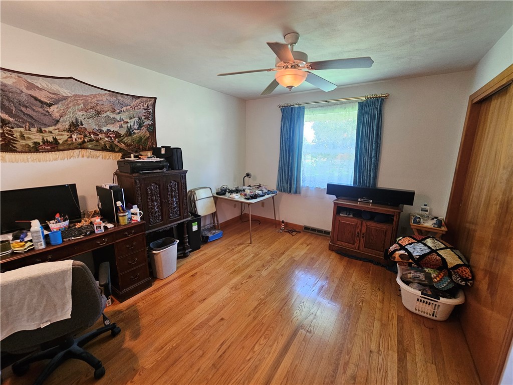 3998 Willowcrest Road Beavercreek, OH 45430 - Photo 27 of 41 This versatile room features warm wood flooring and ample natural light, ideal for various uses.