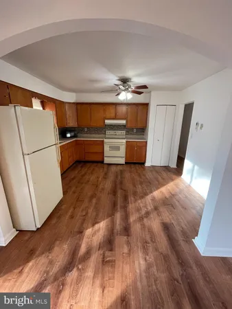 a view of washer and dryer with wooden floor