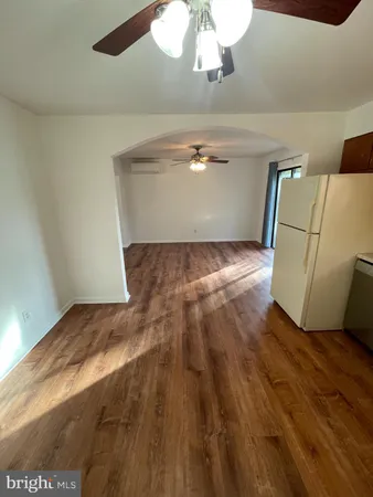 a view of kitchen and empty room