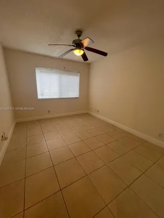 a view of a room with projector and tiles