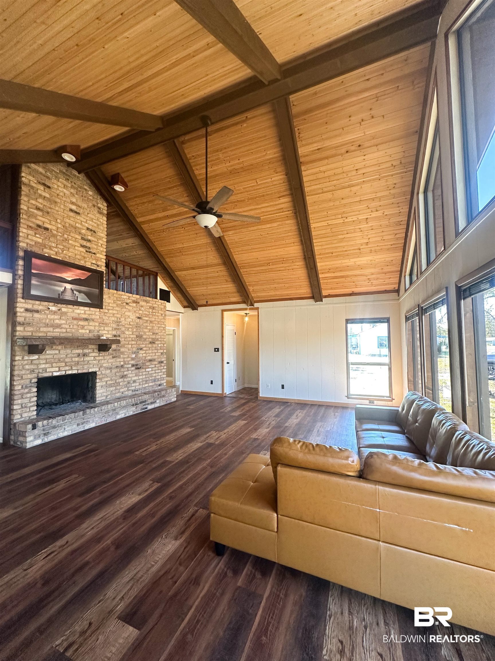 1104 North Pine Street Foley, AL 36535 - Photo 25 of 35 Living room with beam ceiling, a fireplace, wood ceiling, and hardwood / wood-style floors