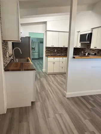 a kitchen with a stove and a refrigerator