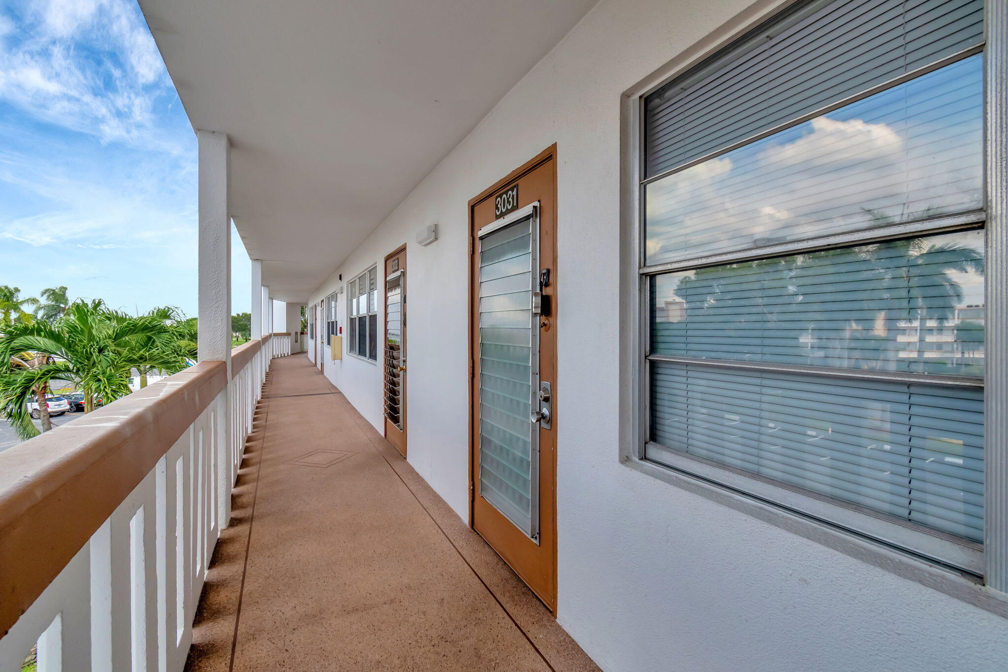 3031 Cornwall East Boca Raton, FL 33434 - Photo 48 of 84 a view of a balcony with wooden floor and stairs