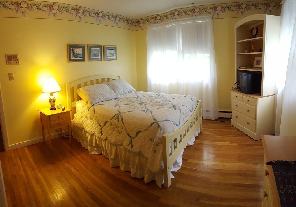 7 Mohawk Road Canton, MA 02021 - Photo 10 of 19 a bedroom with a bed and wooden floor