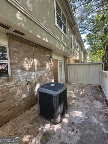 a view of a patio with table and chairs