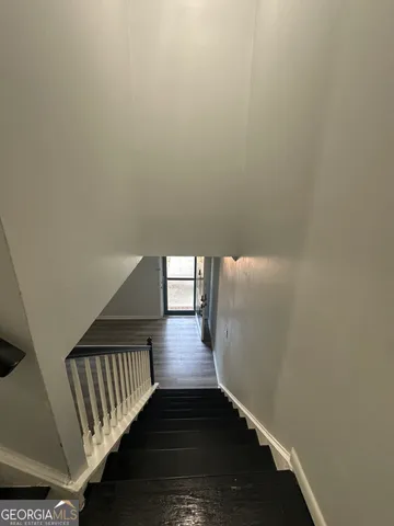 a view of entryway with wooden floor
