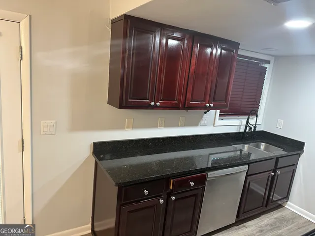 a kitchen with a sink and cabinets
