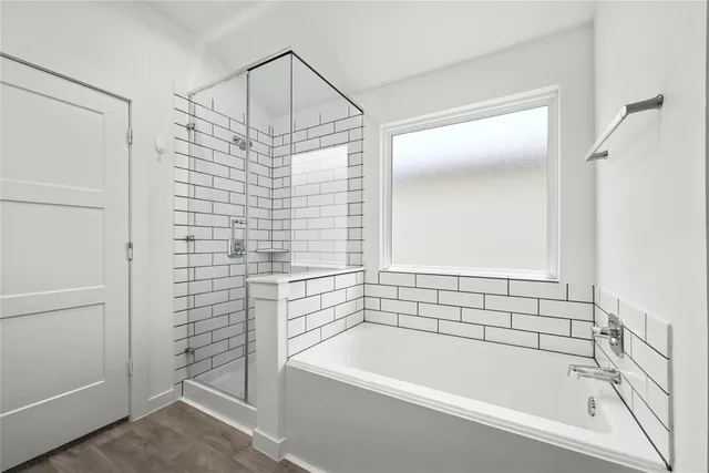 a bathroom with a shower and bathtub