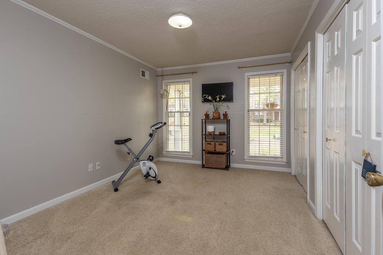 2225 Webbing Drive Memphis, TN 38016 - Photo 20 of 25 a view of a room with gym equipment and a window