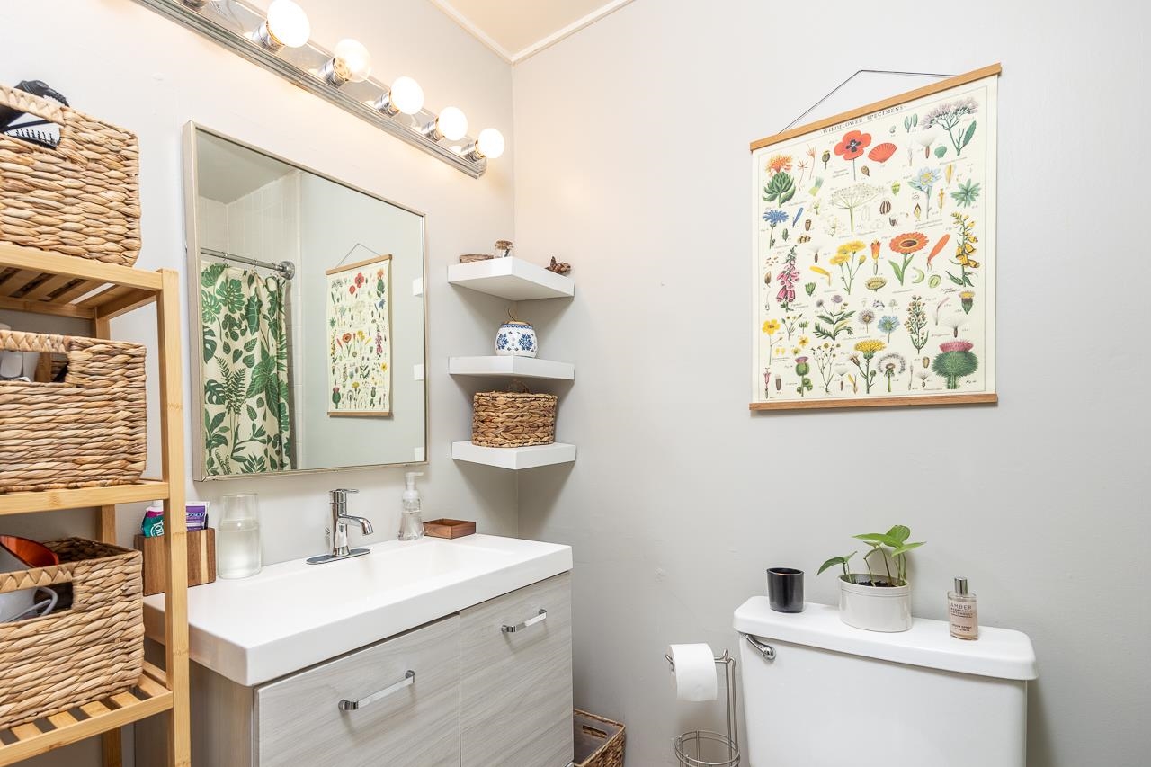 2225 Webbing Drive Memphis, TN 38016 - Photo 9 of 25 a bathroom with a sink toilet and a window