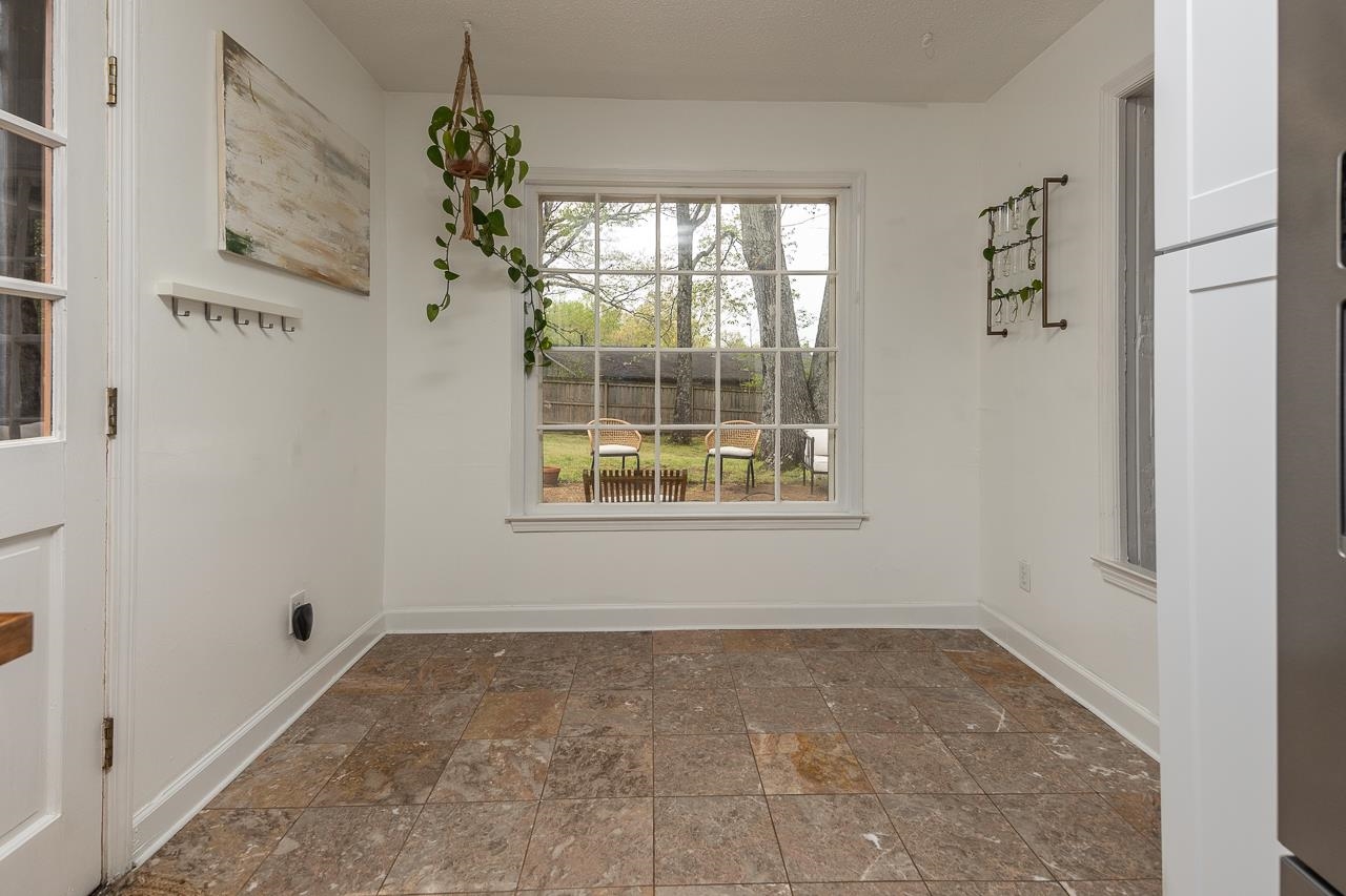 2225 Webbing Drive Memphis, TN 38016 - Photo 10 of 25 an empty room with windows and entrance