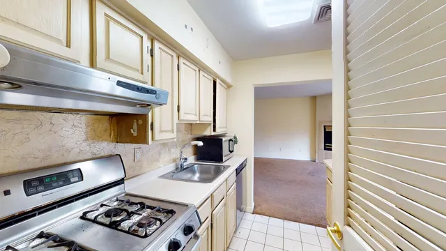 a kitchen with a stove and a microwave