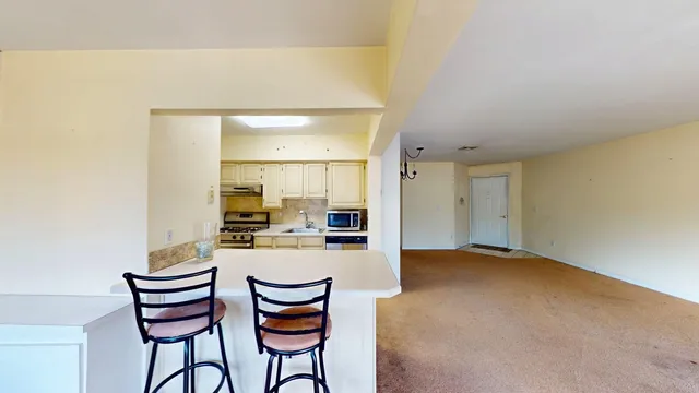 a kitchen with a table and chairs in it