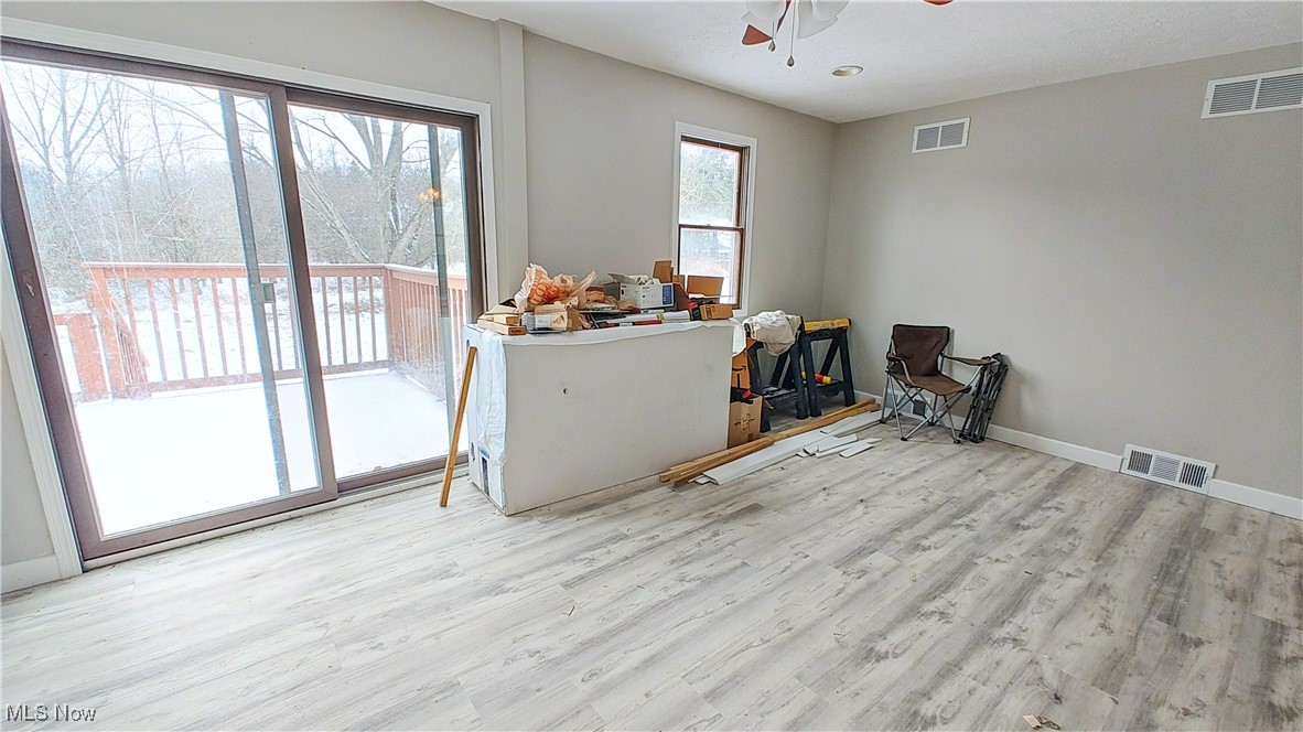 13885 Beard Road New Springfield, OH 44443 - Photo 2 of 27 Kitchen and Great Room in the 2 bedroom addition. Walk out to the large deck.