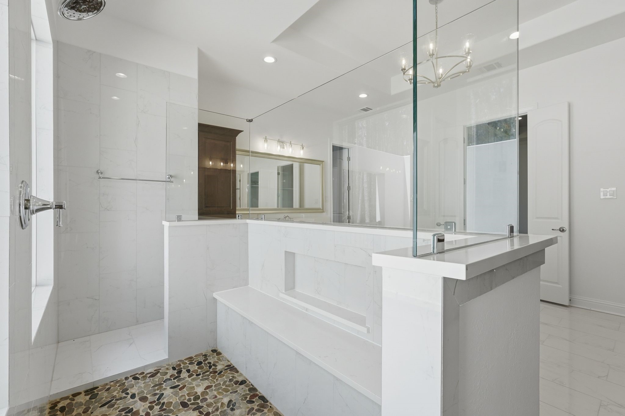 16081 Forest Mill Road Willis, TX 77378 - Photo 21 of 37 Oversized walk-in shower features elegant tilework, glass enclosure, and a spacious design that enhances the spa-like feel of the primary bath.