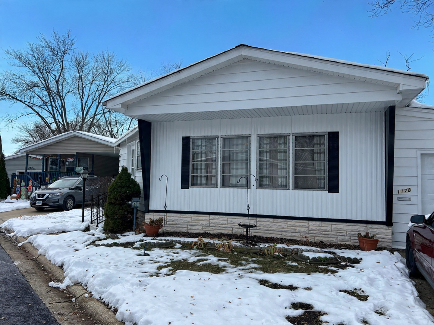 1178 Country Club Road Elgin, IL 60123 - Photo 2 of 7 a front view of a house