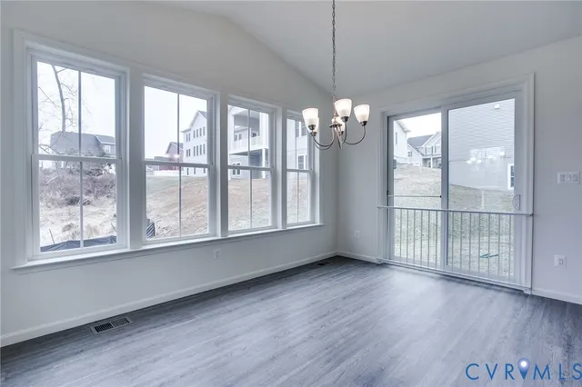 a view of livingroom with furniture wooden floor and chandelier