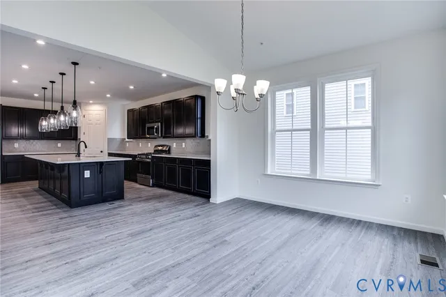 a view of an entryway with wooden floor and stairs