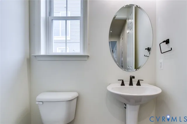 an empty room with windows and entrance