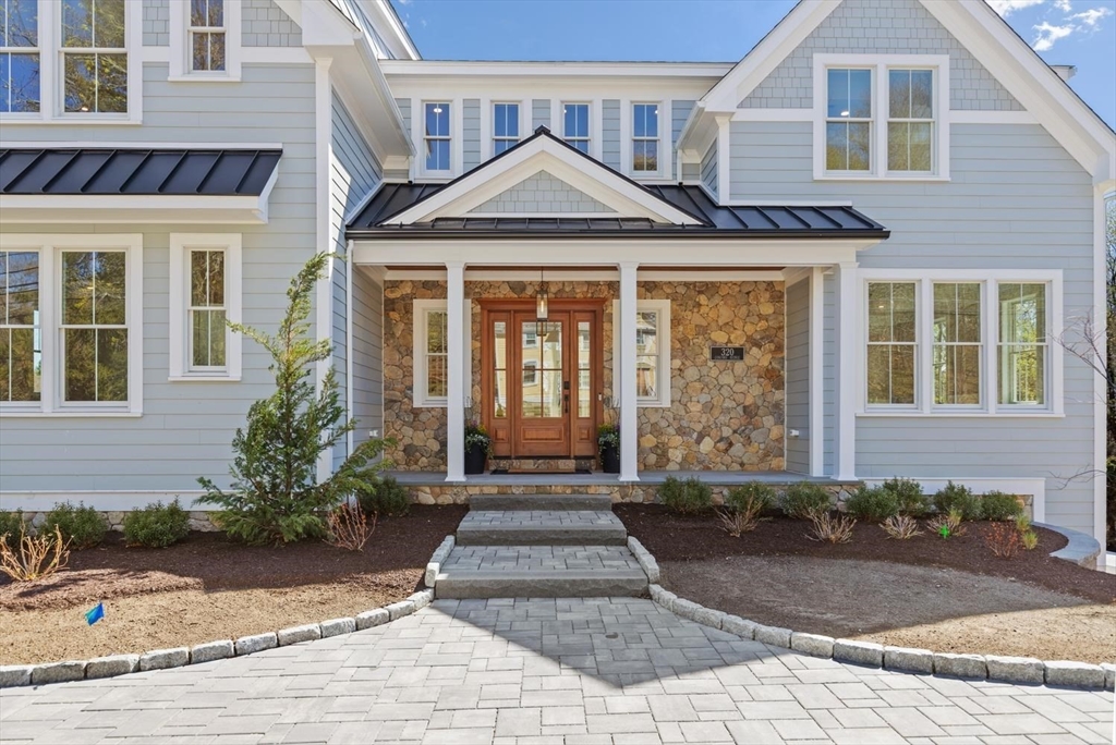 320 Concord Avenue Lexington, MA 02421 - Photo 2 of 40 a front view of a house with garden