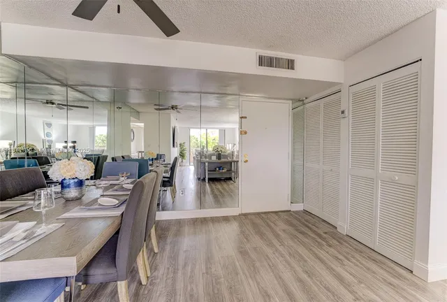 a view of a dining area with furniture and wooden floor