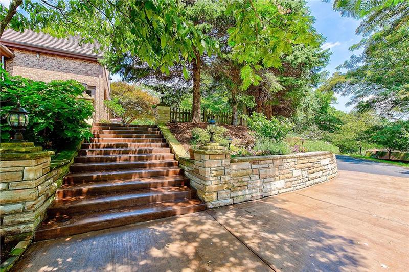 212 Mingo Road Wexford, PA 15090 - Photo 22 of 25 The property is surrounded by mature landscape and custom hardscape.