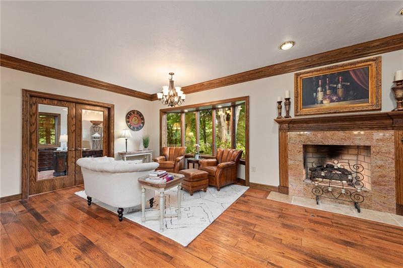 212 Mingo Road Wexford, PA 15090 - Photo 6 of 25 Wood burning fireplace and solid smoked white oak hardwood floors