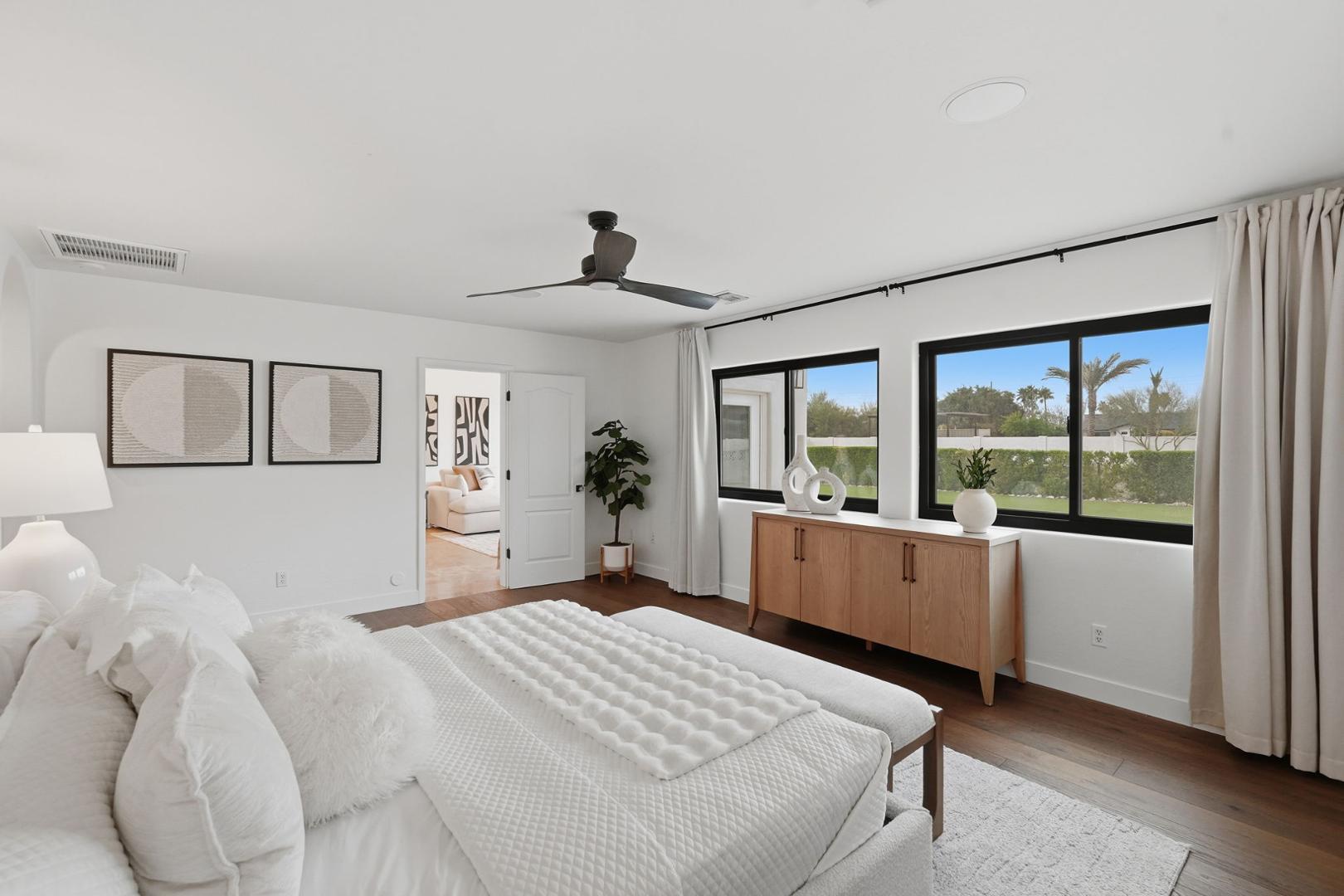 6302 East Cochise Road Paradise Valley, AZ 85253 - Photo 11 of 58 a bedroom with a large bed and a large window
