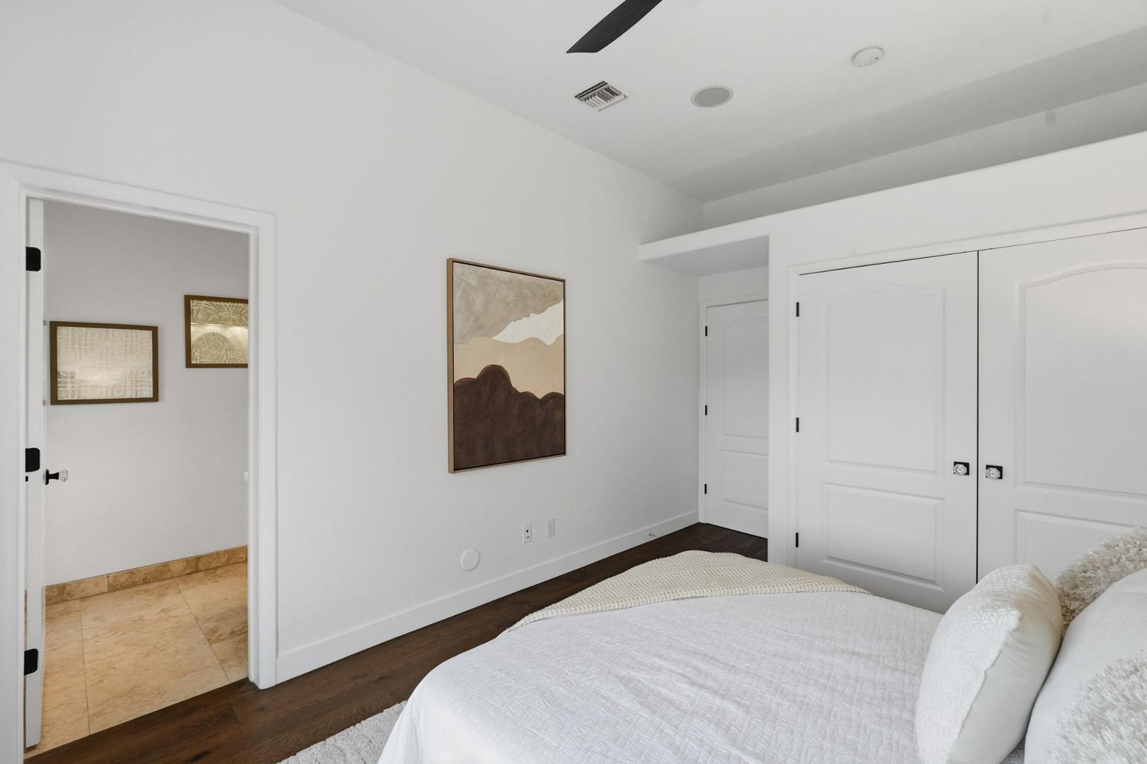 6302 East Cochise Road Paradise Valley, AZ 85253 - Photo 16 of 58 a bedroom with a bed and a painting on the wall