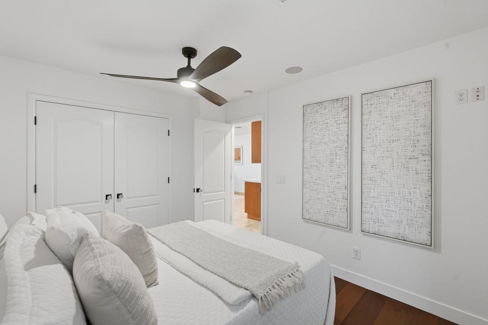 6302 East Cochise Road Paradise Valley, AZ 85253 - Photo 18 of 58 a bedroom with a bed and a chandelier