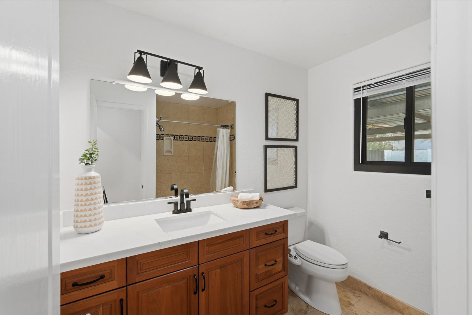 6302 East Cochise Road Paradise Valley, AZ 85253 - Photo 19 of 58 a bathroom with a sink a toilet and mirror