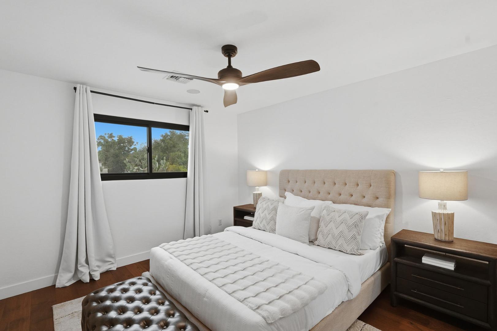 6302 East Cochise Road Paradise Valley, AZ 85253 - Photo 20 of 58 a bedroom with a bed and a window