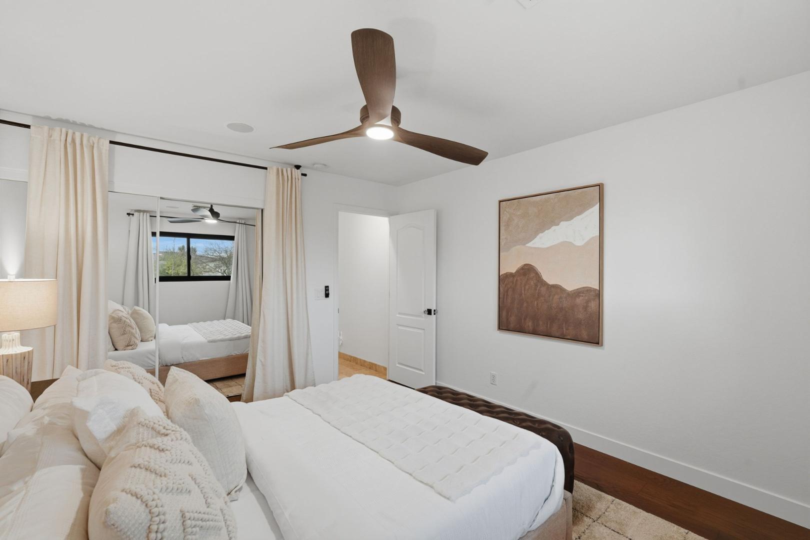 6302 East Cochise Road Paradise Valley, AZ 85253 - Photo 21 of 58 a bedroom with a bed and a painting on the wall