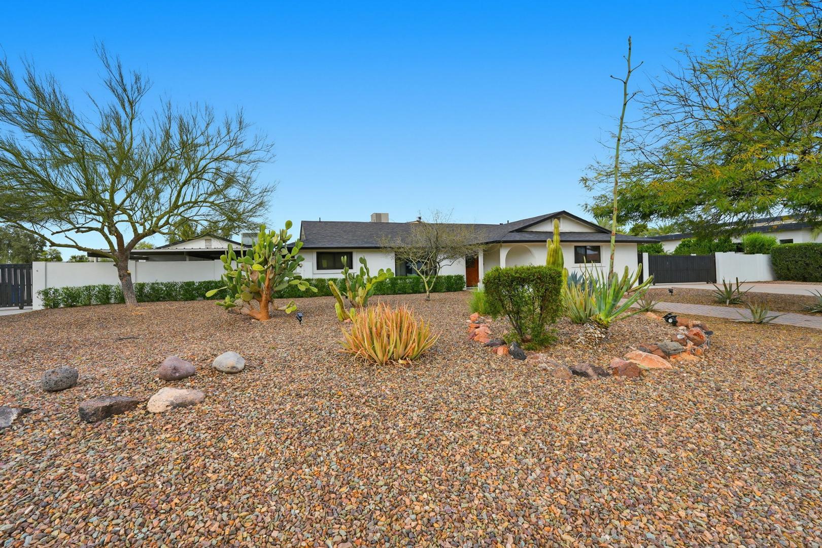 6302 East Cochise Road Paradise Valley, AZ 85253 - Photo 22 of 58 a view of a house with backyard and a tree