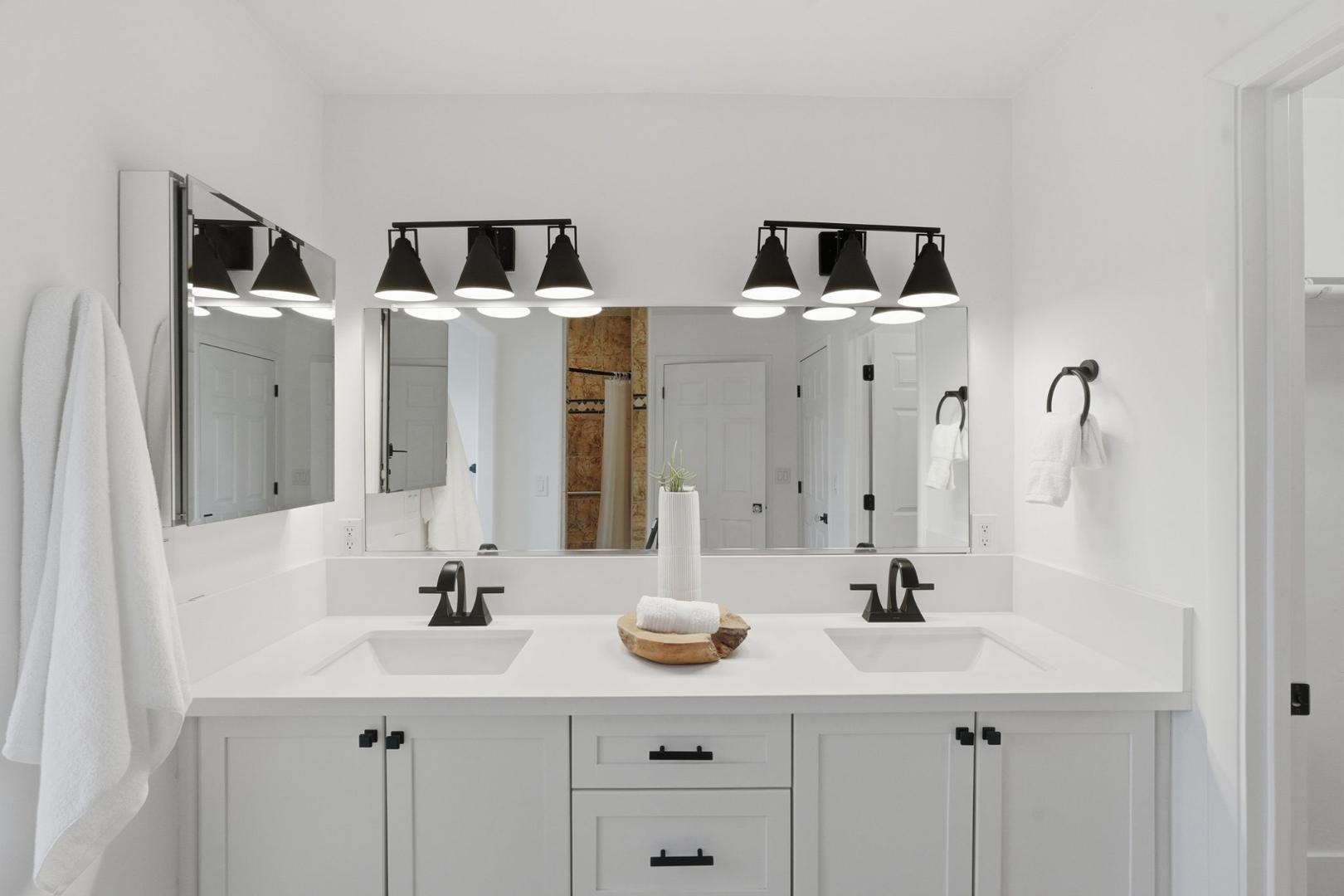 6302 East Cochise Road Paradise Valley, AZ 85253 - Photo 35 of 58 a bathroom with double vanity sinks and mirror