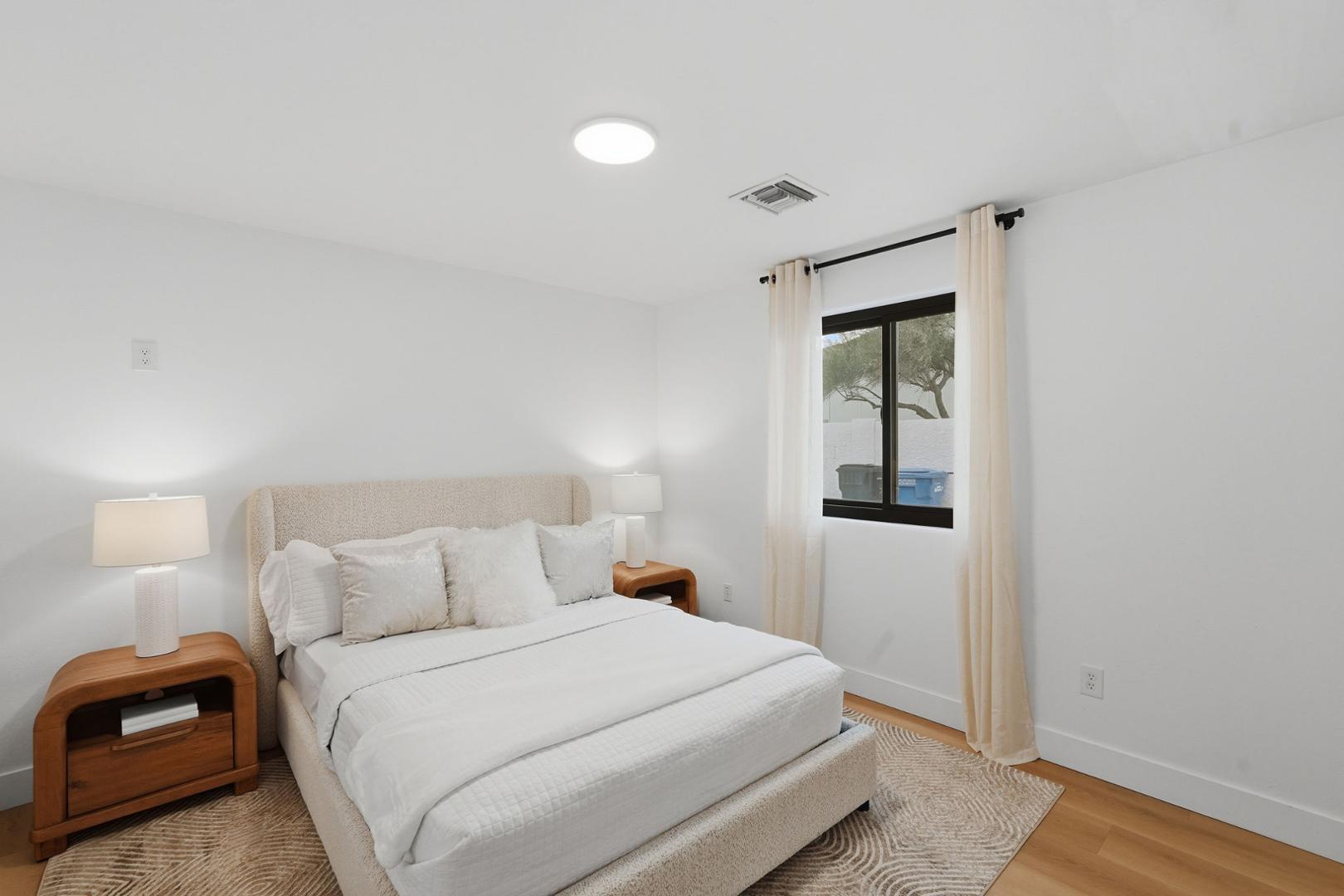 6302 East Cochise Road Paradise Valley, AZ 85253 - Photo 36 of 58 a bedroom with a bed and a window