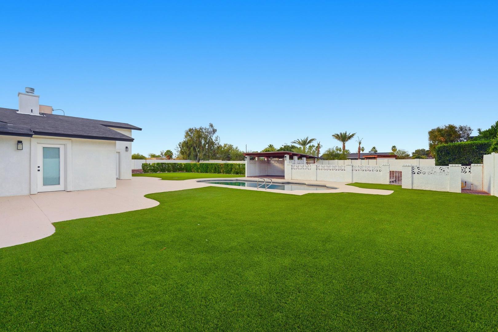 6302 East Cochise Road Paradise Valley, AZ 85253 - Photo 44 of 58 a view of a house with a yard