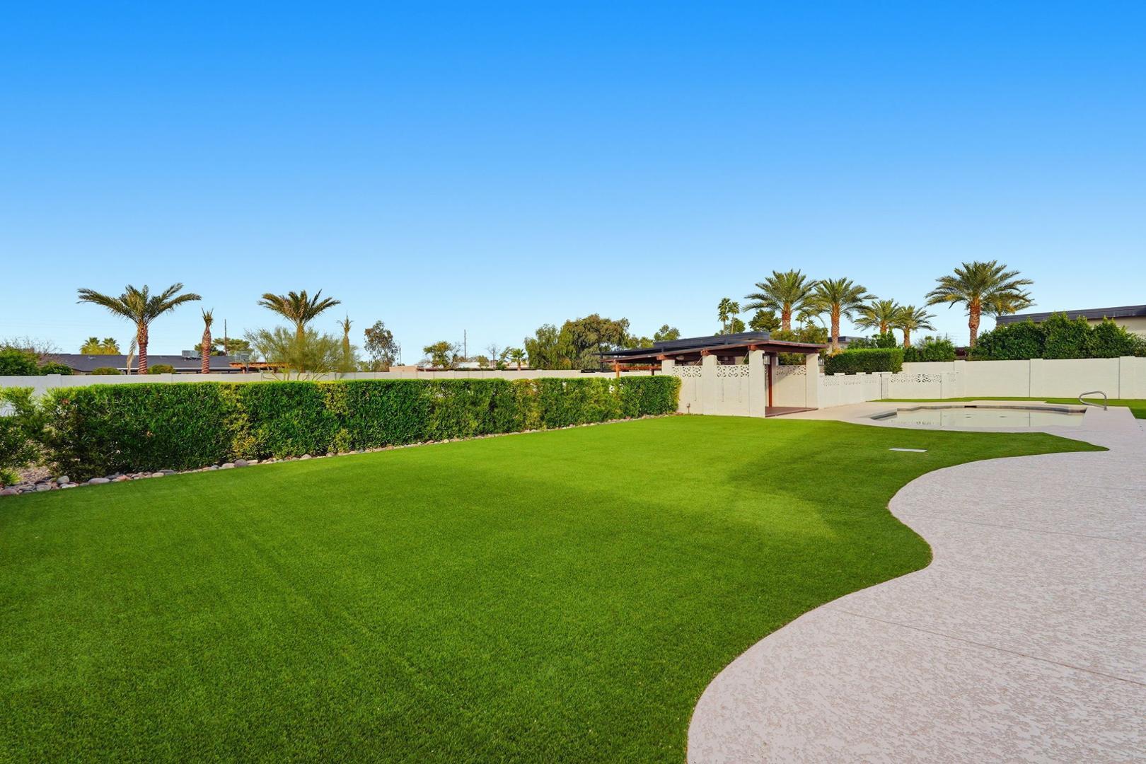 6302 East Cochise Road Paradise Valley, AZ 85253 - Photo 47 of 58 a view of a golf course with a lake