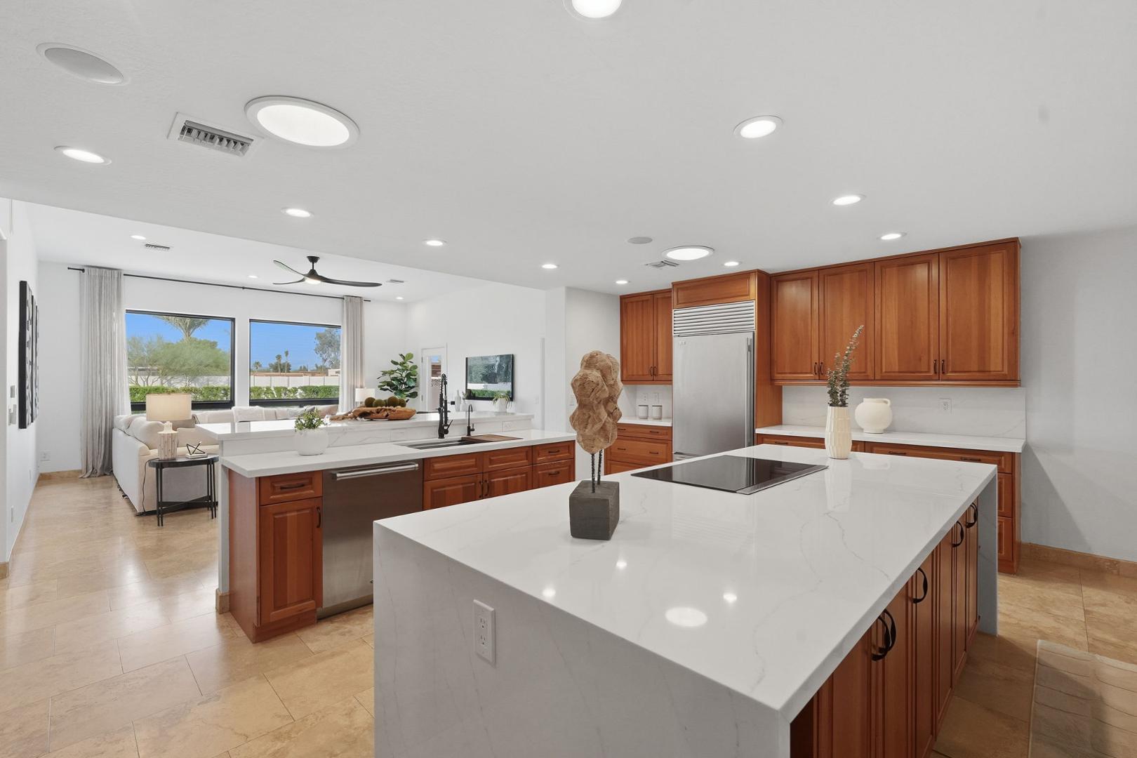 6302 East Cochise Road Paradise Valley, AZ 85253 - Photo 56 of 58 a kitchen with stainless steel appliances granite countertop a sink a stove and a refrigerator